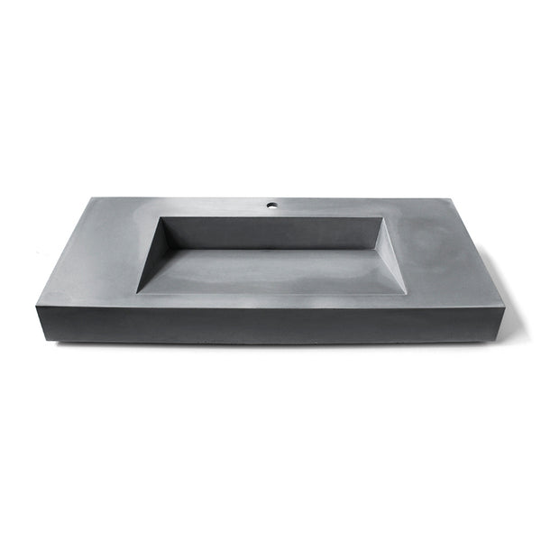 Vero XL concrete sink by Unrefined in matte grey with angular trapezoidal basin.